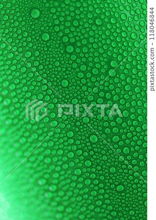 water drop on green beverage cans background, texture of cold aluminium drink package 118046844