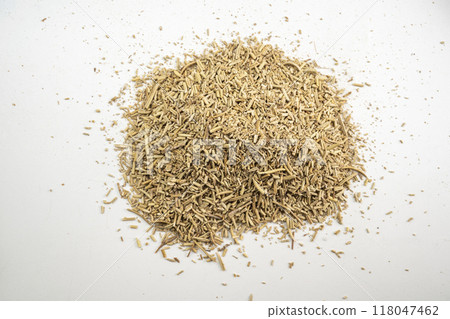 A pile of herbs and spices on a white background 118047462