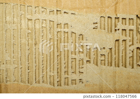 A cardboard box with a hole in it A cardboard box with a hole in it 118047566