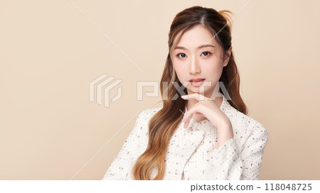 Beautiful young asian woman with clean fresh skin on beige background, Face care, Facial treatment, Cosmetology, beauty and spa, Asian women portrait. 118048725