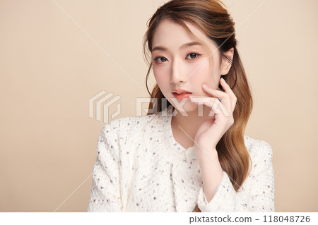 Beautiful young asian woman with clean fresh skin on beige background, Face care, Facial treatment, Cosmetology, beauty and spa, Asian women portrait. 118048726