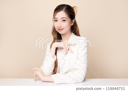Beautiful young asian woman with clean fresh skin on beige background, Face care, Facial treatment, Cosmetology, beauty and spa, Asian women portrait. 118048731