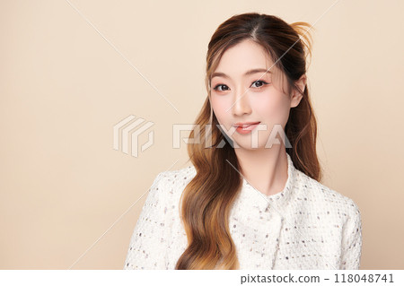 Beautiful young asian woman with clean fresh skin on beige background, Face care, Facial treatment, Cosmetology, beauty and spa, Asian women portrait. Beautiful young asian woman with clean fresh skin on beige background, Face care, Facial treatment, Cosmetology, beauty and spa, Asian women portrait. 118048741
