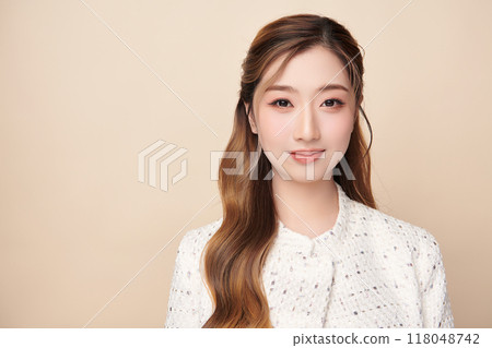 Beautiful young asian woman with clean fresh skin on beige background, Face care, Facial treatment, Cosmetology, beauty and spa, Asian women portrait. Beautiful young asian woman with clean fresh skin on beige background, Face care, Facial treatment, Cosmetology, beauty and spa, Asian women portrait. 118048742