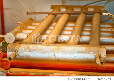Vintage grunge metal heating battery old pipe section Vintage grunge metal heating battery old pipe section 118048761