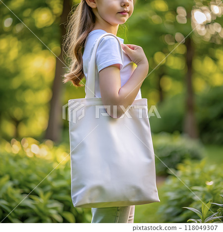 Tote bag mockup. Girl carrying reusable white cotton linen eco organic fabric canvas blank totebag with natural green leaves trees background. AI generated Tote bag mockup. Girl carrying reusable white cotton linen eco organic fabric canvas blank totebag with natural green leaves trees background. AI generated 118049307