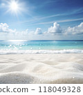 Beach mockup background. White blank sand in summer for product display design against blurred blue tropical sea ocean sky and sun 118049328