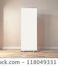 Rollup banners stand mockup. Blank clear white rollup poster with space for logo or text on wooden floor with light beige wall in empty room 118049331