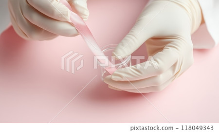 Scientist Analyzing DNA Sample with Protective Gloves in Laboratory, Symbolizing Breast Cancer Awareness 118049343