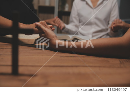 Christian group are praying to god with the bible and sharing the gospel. Concept of faith for god. Christian group are praying to god with the bible and sharing the gospel. Concept of faith for god. 118049497