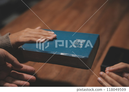 Christian group are praying to god with the bible and sharing the gospel. Concept of faith for god. 118049509