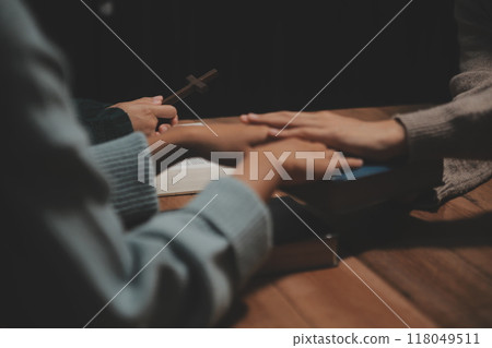 Christian group are praying to god with the bible and sharing the gospel. Concept of faith for god. 118049511