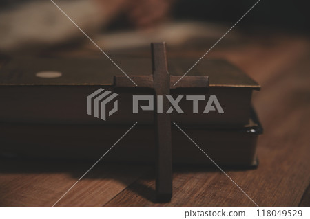 Christian group are praying to god with the bible and sharing the gospel. Concept of faith for god. 118049529