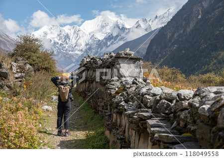 Rear view of tourist while trekking in Langtang national park, Nepal. Langtang Valley Trek is one of the blissful and easy short trip in Nepal. 118049558
