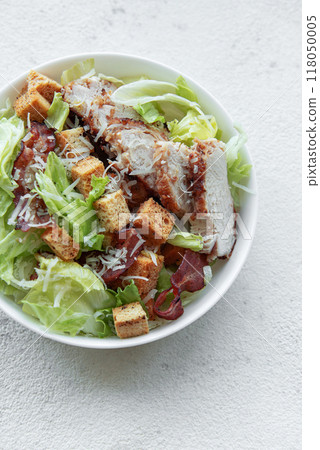 A bowl  of  Caesar salad 118050005