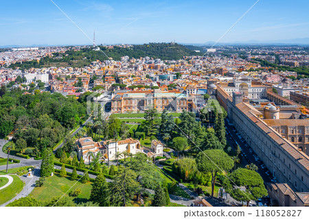 Visitors enjoy the serene beauty of the Vatican Museums and Gardens, surrounded by lush greenery and historical architecture, showcasing breathtaking views of the cityscape of Rome. Visitors enjoy the serene beauty of the Vatican Museums and Gardens, surrounded by lush greenery and historical architecture, showcasing breathtaking views of the cityscape of Rome. 118052827