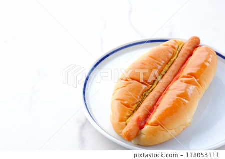 Chorizo sausage bun (hot dog) with mustard and ketchup 118053111