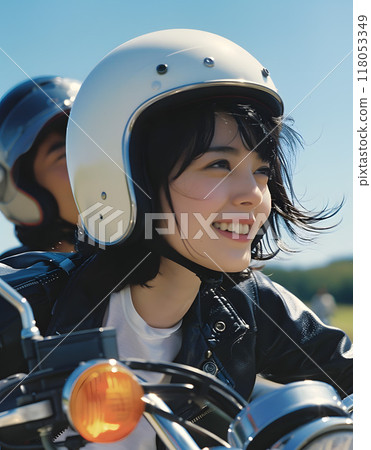Asian woman riding a motorbike 118053349