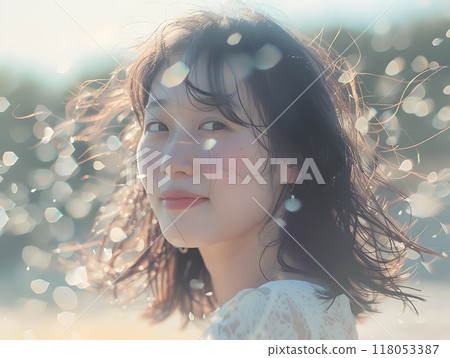 Asian woman bathed in soft sunlight Asian woman bathed in soft sunlight 118053387