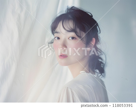 Asian woman bathed in soft sunlight Asian woman bathed in soft sunlight 118053391