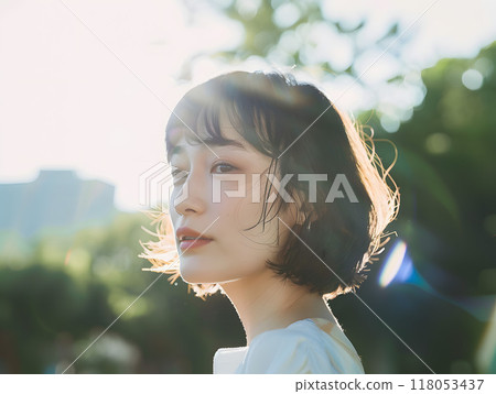 Asian woman bathed in soft sunlight Asian woman bathed in soft sunlight 118053437