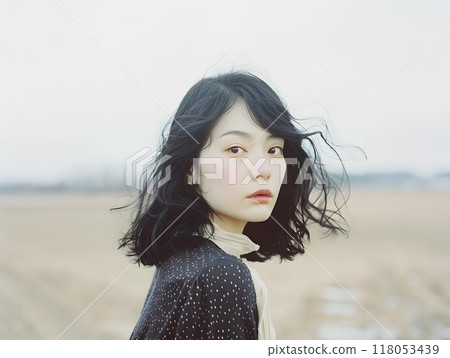 Asian woman bathed in soft sunlight Asian woman bathed in soft sunlight 118053439