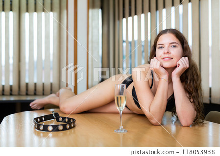 Young female in black lingerie posing in the meeting room Young female in black lingerie posing in the meeting room 118053938