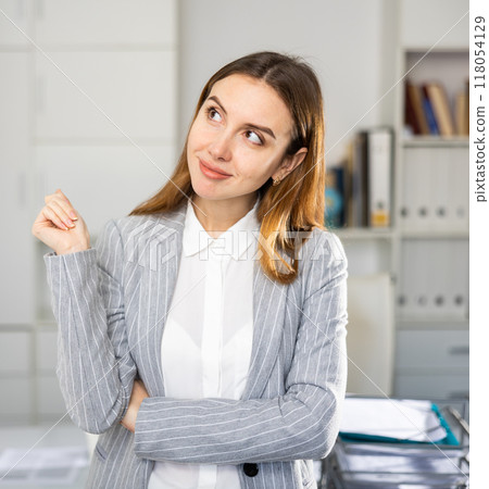 Portrait of contemplative young woman manager in suit Portrait of contemplative young woman manager in suit 118054129