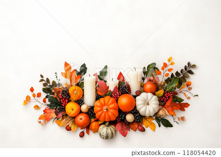 Autumn flat lay featuring pumpkins, candles, and leaves background. Concept of fall, harvest, and Halloween decoration 118054420