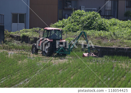 Tractor work, grass cutting Tractor work, grass cutting 118054425