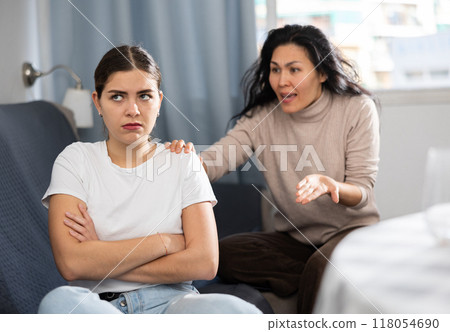 Annoyed stressed female couple sitting at home 118054690