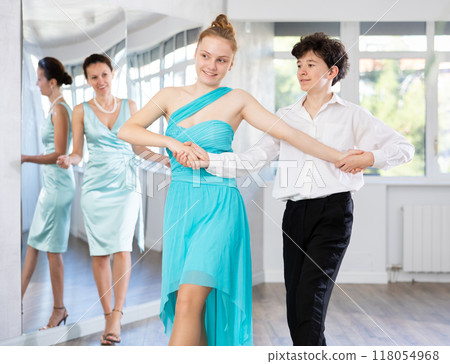 Adolescent dancers rehearsing polka dance number in choreography studio 118054968