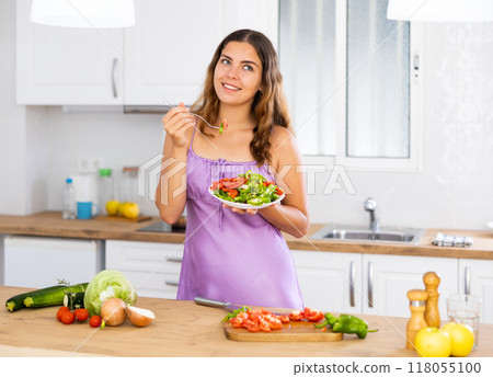 Girl daydreaming about something during breakfast at kitchen 118055100
