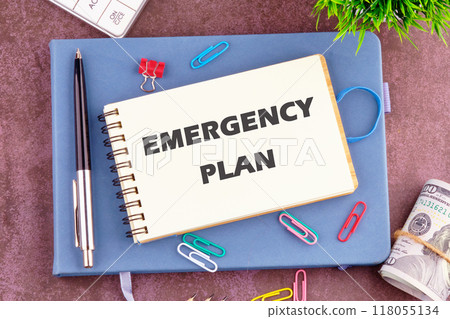 Conceptual emergency plan symbol. Copy space. Emergency plan words written in a notebook in a composition with office supplies, top view 118055134