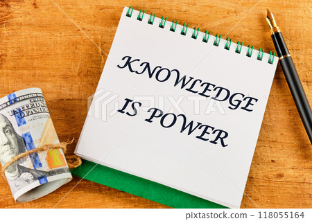 KNOWLEDGE IS POWER words on a blank sheet of notebook against a papyrus background KNOWLEDGE IS POWER words on a blank sheet of notebook against a papyrus background 118055164
