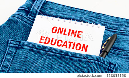 Copy space and business concept. ONLINE EDUCATION words on a notebook in red letters in jeans Copy space and business concept. ONLINE EDUCATION words on a notebook in red letters in jeans 118055168