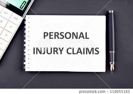Legal services of lawyers for medical malpractice claims. PERSONAL INJURY CLAIMS words in a notebook, top view in a composition with a fountain pen and a calculator Legal services of lawyers for medical malpractice claims. PERSONAL INJURY CLAIMS words in a notebook, top view in a composition with a fountain pen and a calculator 118055183