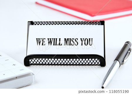 WE WILL MISS YOU written on a business card on a white background WE WILL MISS YOU written on a business card on a white background 118055190