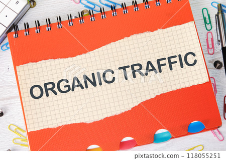The word ORGANIC TRAFFIC written on a piece of paper in a cage on the background of a notebook The word ORGANIC TRAFFIC written on a piece of paper in a cage on the background of a notebook 118055251