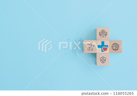 Wood block with health care medical icon on blue background. health insurance, love, international cardiology day, check up, heart attack and cardiology. Wood block with health care medical icon on blue background. health insurance, love, international cardiology day, check up, heart attack and cardiology. 118055265