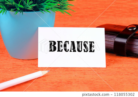 Word BECAUSE on a white business card on an orange background 118055302