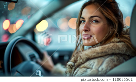Wide angle interior view of young woman in winter coat driving the car 118055561