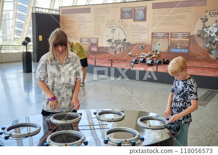 Young Explorers Engaged in Interactive Learning at Valencia's Science Museum Exhibit in the City of Arts and Sciences. Children Discovering Scientific Wonders Inside Valencia's Renowned Natural Young Explorers Engaged in Interactive Learning at Valencia's Science Museum Exhibit in the City of Arts and Sciences. Children Discovering Scientific Wonders Inside Valencia's Renowned Natural 118056573