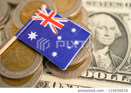 Stack of coins with Australia flag and US dollar banknotes. 118056630