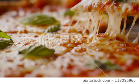 Close-up of pizza details with oozing cheese 118056963