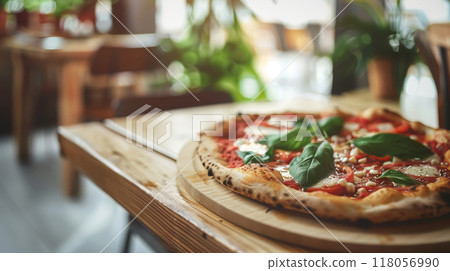 Authentic Italian pizza on old rustic wooden table top view with bokeh kitchen background 118056990