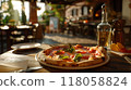 pizza on wooden table in pizzeria restaurant background 118058824