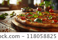 pizza on wooden table with ingredients in pizzeria restaurant background 118058825