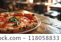 closeup pizza on wooden table in pizzeria restaurant background 118058833