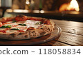closeup pizza on wooden table in pizzeria restaurant background 118058834